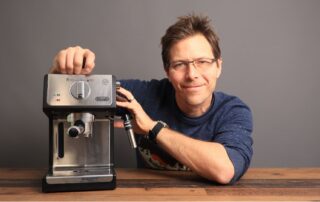 Man with Delonghi ECP3420 home espresso machine.