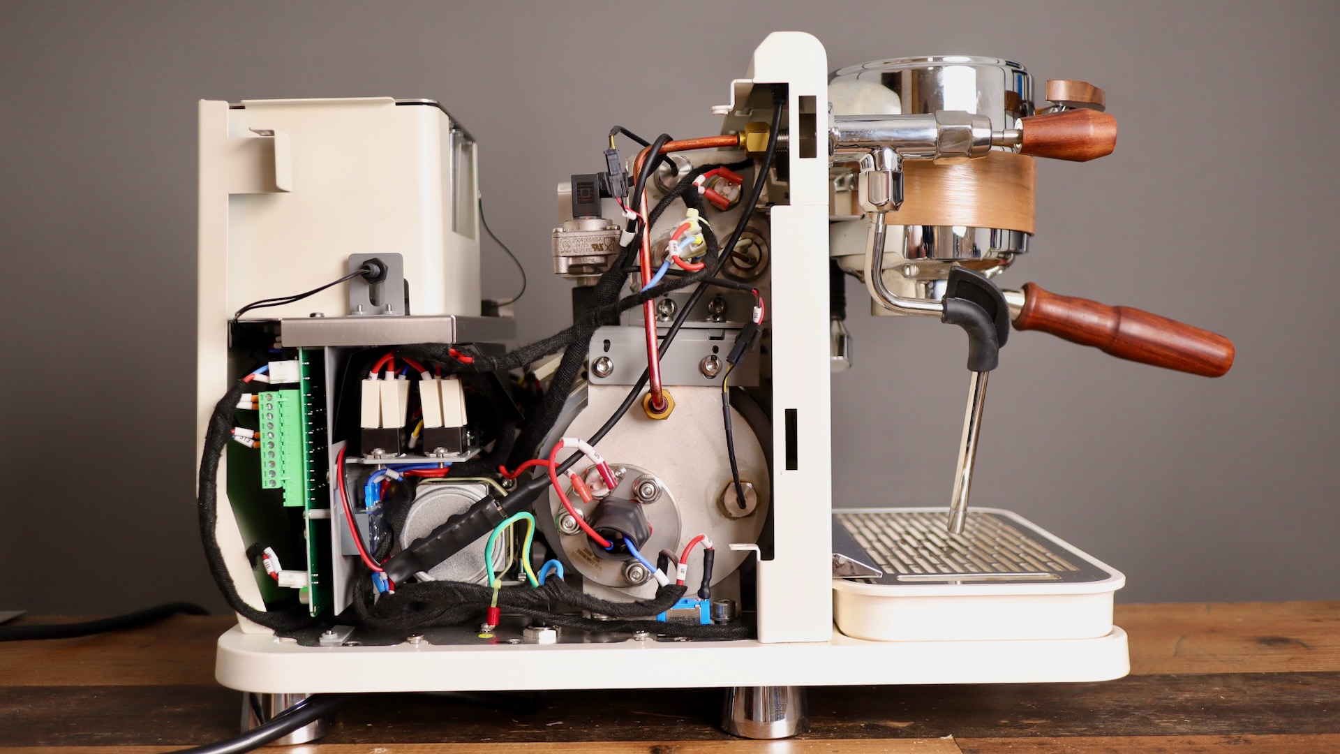 Left side exposed on the Wendougee Data S espresso machine showing boiler, PCB, gear pump, etc.